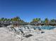 Spacious pool deck with plenty of lounge chairs for sunbathing at 5013 Sevilla Shores Dr, Wimauma, FL 33598