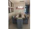 Spacious dining room featuring a large rectangular table and modern decor at 5013 Sevilla Shores Dr, Wimauma, FL 33598