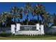 Valencia del Sol community entrance with lush landscaping at 5013 Sevilla Shores Dr, Wimauma, FL 33598