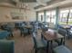 Community clubhouse game room with tables and chairs at 5013 Sevilla Shores Dr, Wimauma, FL 33598