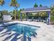 Inviting spa with comfortable seating under a shaded pergola at 5013 Sevilla Shores Dr, Wimauma, FL 33598