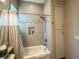 Updated bathroom with a shower/tub combo and modern fixtures at 5013 Sevilla Shores Dr, Wimauma, FL 33598