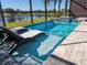 Enjoy this beautiful pool with a screened enclosure and lake view at 5013 Sevilla Shores Dr, Wimauma, FL 33598