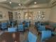 Bright and airy community game room with many tables at 5013 Sevilla Shores Dr, Wimauma, FL 33598