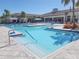 Community swimming pool with a spacious deck area at 5013 Sevilla Shores Dr, Wimauma, FL 33598
