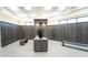 Clean and spacious locker room with individual lockers and a seating area at 5704 Arnie Loop, Lakewood Ranch, FL 34211