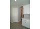 Hallway with white trim and doors leading to other rooms at 17434 Crisp Apple Ln, Land O Lakes, FL 34638