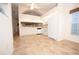 Eat-in kitchen with white appliances and tile flooring at 38335 Eucalyptus Dr, Zephyrhills, FL 33542