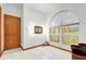 Bright bathroom with large arched window and tiled floor at 26142 Mountainview Blvd, Brooksville, FL 34602