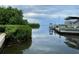 Scenic canal view with boats docked and lush vegetation at 1714 69Th W Ave # B301, Bradenton, FL 34207