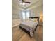 Comfortable bedroom with ceiling fan, tray ceiling, and bright windows at 1241 Riverscape St, Bradenton, FL 34208