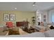 Light and airy living room featuring a sectional sofa and built-in shelving at 7482 Sea Manatee St, Parrish, FL 34219