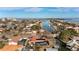 Stunning aerial showcasing waterfront home and neighborhood at 351 Harbor Psge, Clearwater Beach, FL 33767