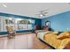 Bright bedroom with wood floors, featuring a ceiling fan and water views at 351 Harbor Psge, Clearwater Beach, FL 33767