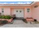 Welcoming front entrance with double doors, decorative planters, and brick accents at 351 Harbor Psge, Clearwater Beach, FL 33767