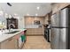 Bright kitchen boasts stainless steel appliances and light wood cabinetry at 351 Harbor Psge, Clearwater Beach, FL 33767