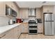Modern kitchen with stainless steel appliances and ample counter space at 351 Harbor Psge, Clearwater Beach, FL 33767