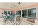 Bright covered patio furnished for outdoor dining and relaxation at 351 Harbor Psge, Clearwater Beach, FL 33767