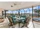 Spacious covered patio with outdoor dining furniture and water views at 351 Harbor Psge, Clearwater Beach, FL 33767