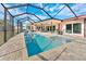 Large, refreshing pool with a spacious patio and screened enclosure at 351 Harbor Psge, Clearwater Beach, FL 33767