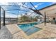 Enjoy this screened-in pool and spa with water views and patio furniture at 351 Harbor Psge, Clearwater Beach, FL 33767
