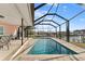 Relaxing rectangular pool with screened enclosure and water views at 351 Harbor Psge, Clearwater Beach, FL 33767