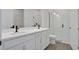 New, modern bathroom with double sink vanity and glass enclosed shower at 9019 Rothman Ln, Lakewood Ranch, FL 34240