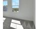Bright bedroom with two windows offering neighborhood views and plenty of sunlight at 9019 Rothman Ln, Lakewood Ranch, FL 34240