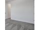 Empty bedroom featuring soft gray carpeting and crisp white walls at 9019 Rothman Ln, Lakewood Ranch, FL 34240
