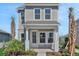Charming two-story home with a welcoming front porch and well-maintained landscaping at 9019 Rothman Ln, Lakewood Ranch, FL 34240