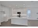 Modern kitchen featuring white cabinets, stainless steel appliances, and undermount sink at 9019 Rothman Ln, Lakewood Ranch, FL 34240