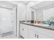 This bathroom features granite countertops, double sinks, tub and shower at 13557 Willow Bluestar Loop, Riverview, FL 33579