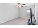 This bedroom features carpet flooring, ceiling fan and a window at 13557 Willow Bluestar Loop, Riverview, FL 33579