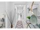 Bright hallway features tile flooring and stylish decorative accents at 13557 Willow Bluestar Loop, Riverview, FL 33579