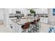 Modern kitchen with granite countertops, stainless steel appliances, and island at 13557 Willow Bluestar Loop, Riverview, FL 33579