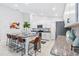 Bright kitchen with island, granite countertops, and barstool seating at 13557 Willow Bluestar Loop, Riverview, FL 33579