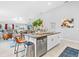 Open kitchen with a large island, stainless appliances, and bar seating at 13557 Willow Bluestar Loop, Riverview, FL 33579