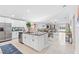 Open concept kitchen featuring an island and stainless steel appliances at 13557 Willow Bluestar Loop, Riverview, FL 33579