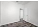 Bedroom featuring new laminate flooring and open doorway to hallway at 1652 Open Field Loop, Brandon, FL 33510