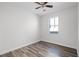 Bedroom featuring new laminate flooring, ceiling fan and window at 1652 Open Field Loop, Brandon, FL 33510