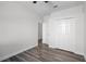 Bedroom featuring new laminate flooring, ceiling fan and double closets at 1652 Open Field Loop, Brandon, FL 33510