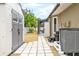 Exterior view of backyard, featuring a storage shed, pool access, and well-maintained landscaping at 909 Dawn St, Venice, FL 34285