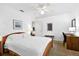 Bright bedroom features ceiling fan, neutral walls, and work space at 909 Dawn St, Venice, FL 34285