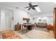 Open concept living room featuring bright sky lights and a comfortable seating arrangement at 909 Dawn St, Venice, FL 34285