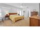 Spacious main bedroom with natural light, hardwood floors, and modern decor at 909 Dawn St, Venice, FL 34285