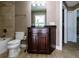 Bathroom featuring tiled shower/tub combo, toilet, and dark vanity with granite counters at 4154 Duluth Ter, North Port, FL 34286