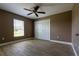 Bedroom with light tile flooring, ceiling fan, and a window with bright sunlight at 4154 Duluth Ter, North Port, FL 34286