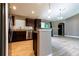 Beautiful kitchen with stainless steel appliances and granite countertops adjacent to a living area at 4154 Duluth Ter, North Port, FL 34286