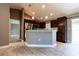 Modern kitchen with stainless steel appliances, dark cabinets and granite countertops at 4154 Duluth Ter, North Port, FL 34286
