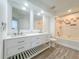 Bathroom featuring a double sink vanity, modern fixtures, and a shower-tub combination at 4007 Bangalow Palm Ct # 4007, Tampa, FL 33624